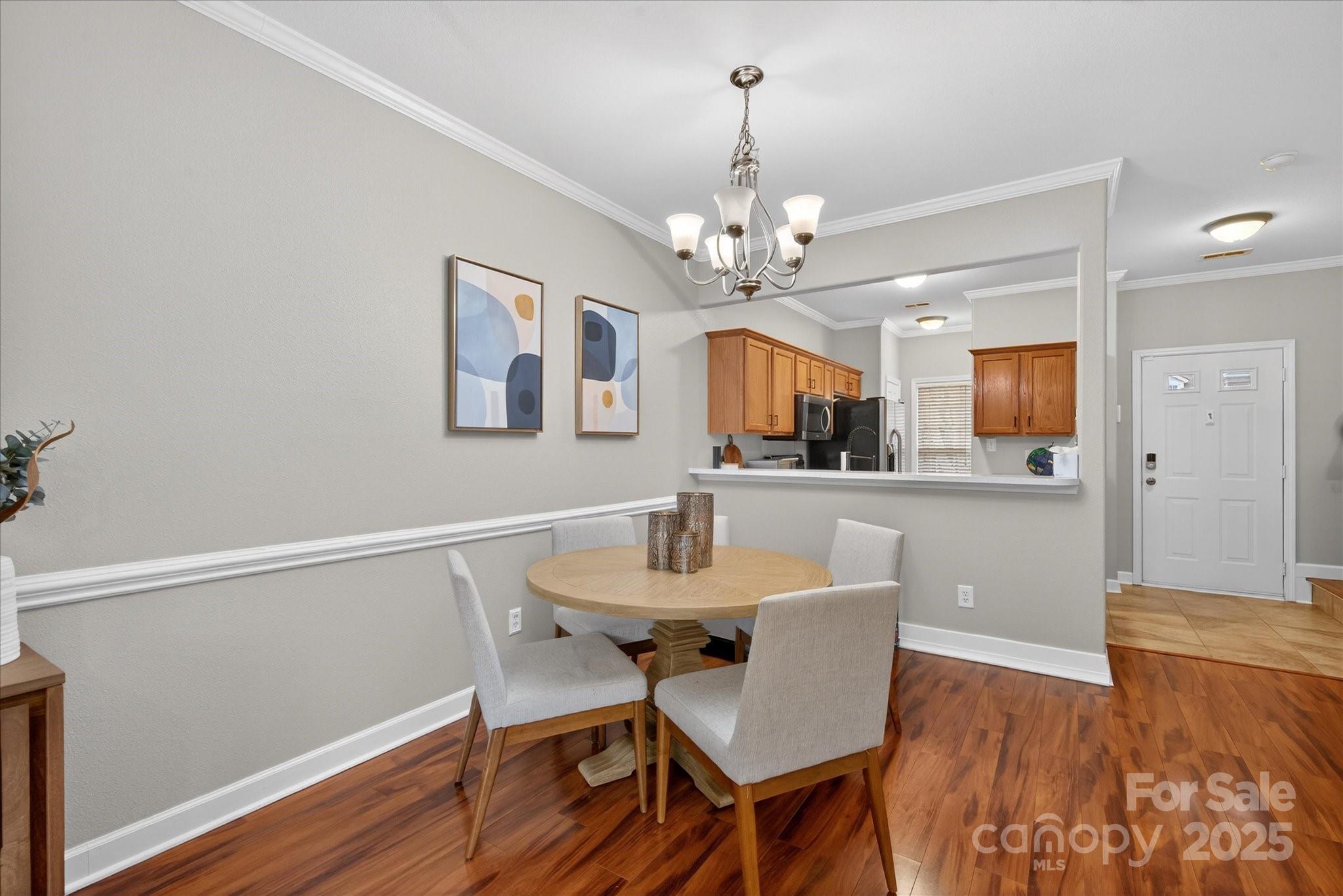 6331 Rhodins Lane Fort Mill, SC 29707 - Photo 13 of 45 a view of a dining room with furniture and wooden floor