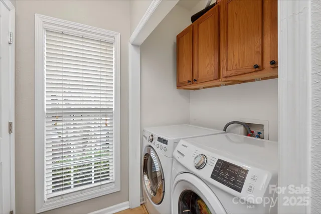 a view of a house with a yard and garage