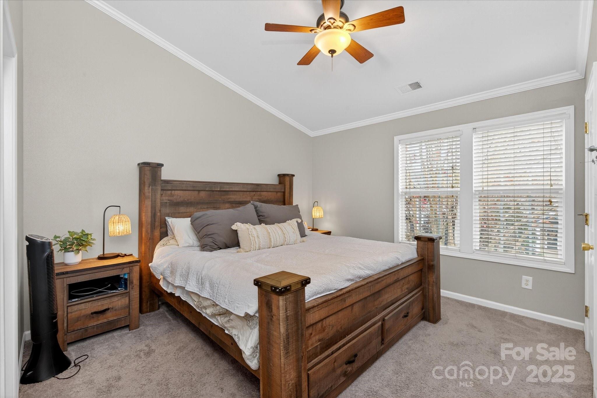 6331 Rhodins Lane Fort Mill, SC 29707 - Photo 21 of 45 a bed sitting in a bedroom next to a window