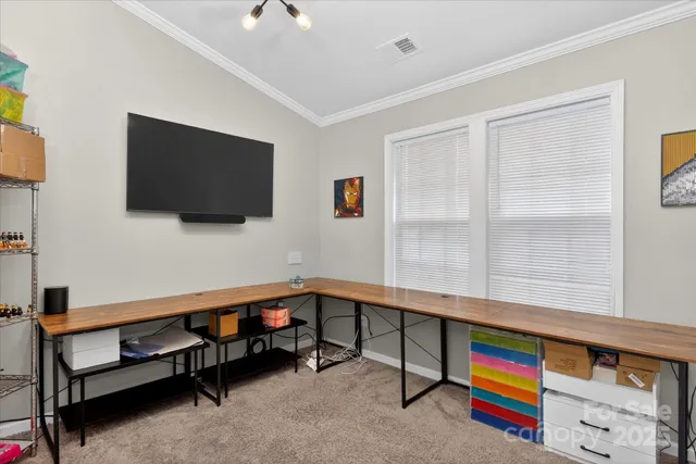 a view of a backyard with a garden and swimming pool