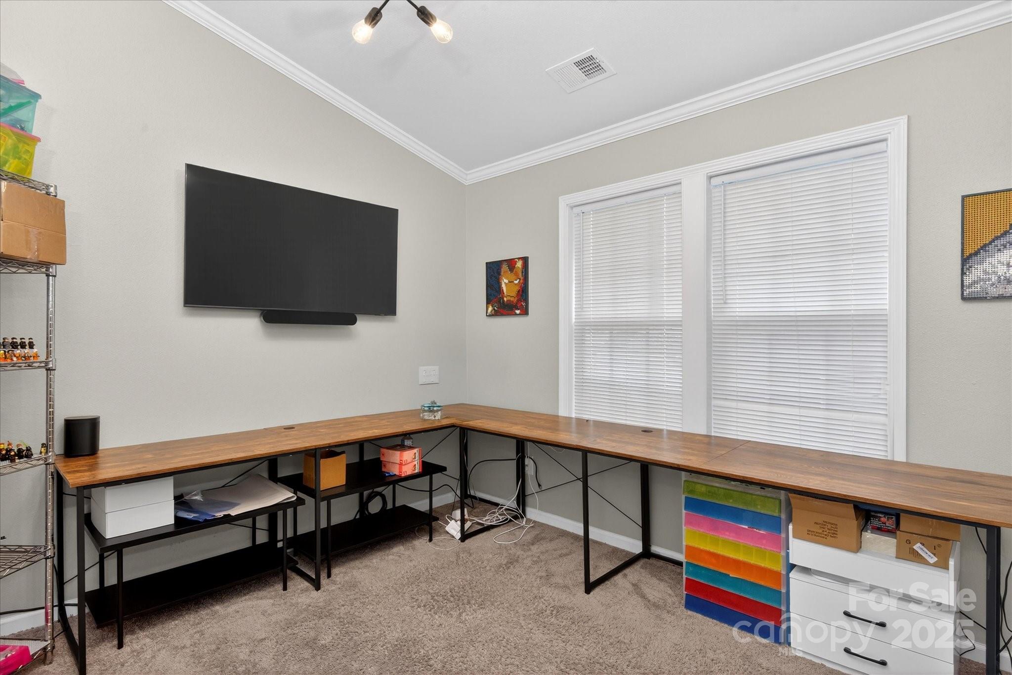 6331 Rhodins Lane Fort Mill, SC 29707 - Photo 23 of 45 a room with furniture and a flat screen tv