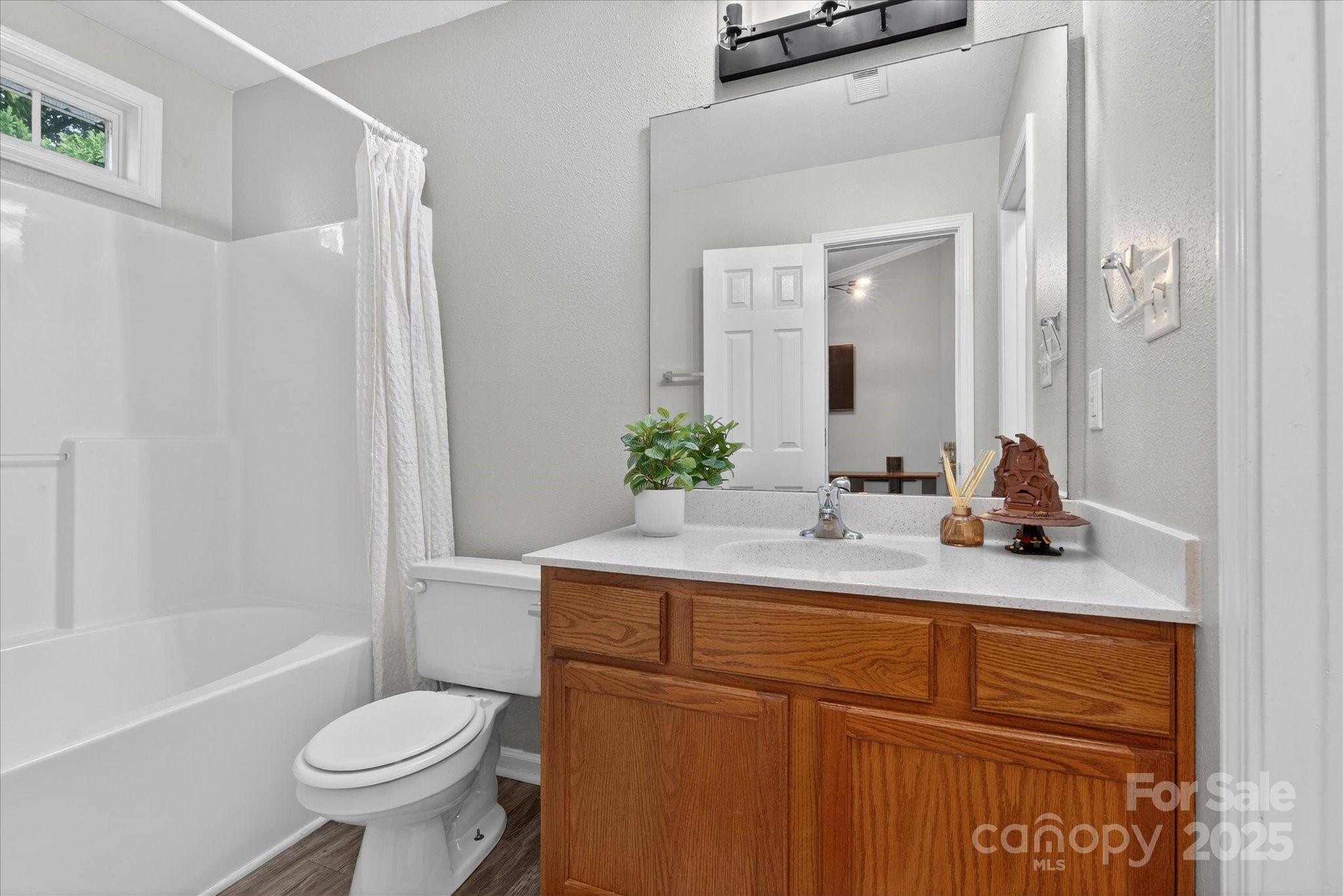 6331 Rhodins Lane Fort Mill, SC 29707 - Photo 24 of 45 a bathroom with a sink a toilet and shower