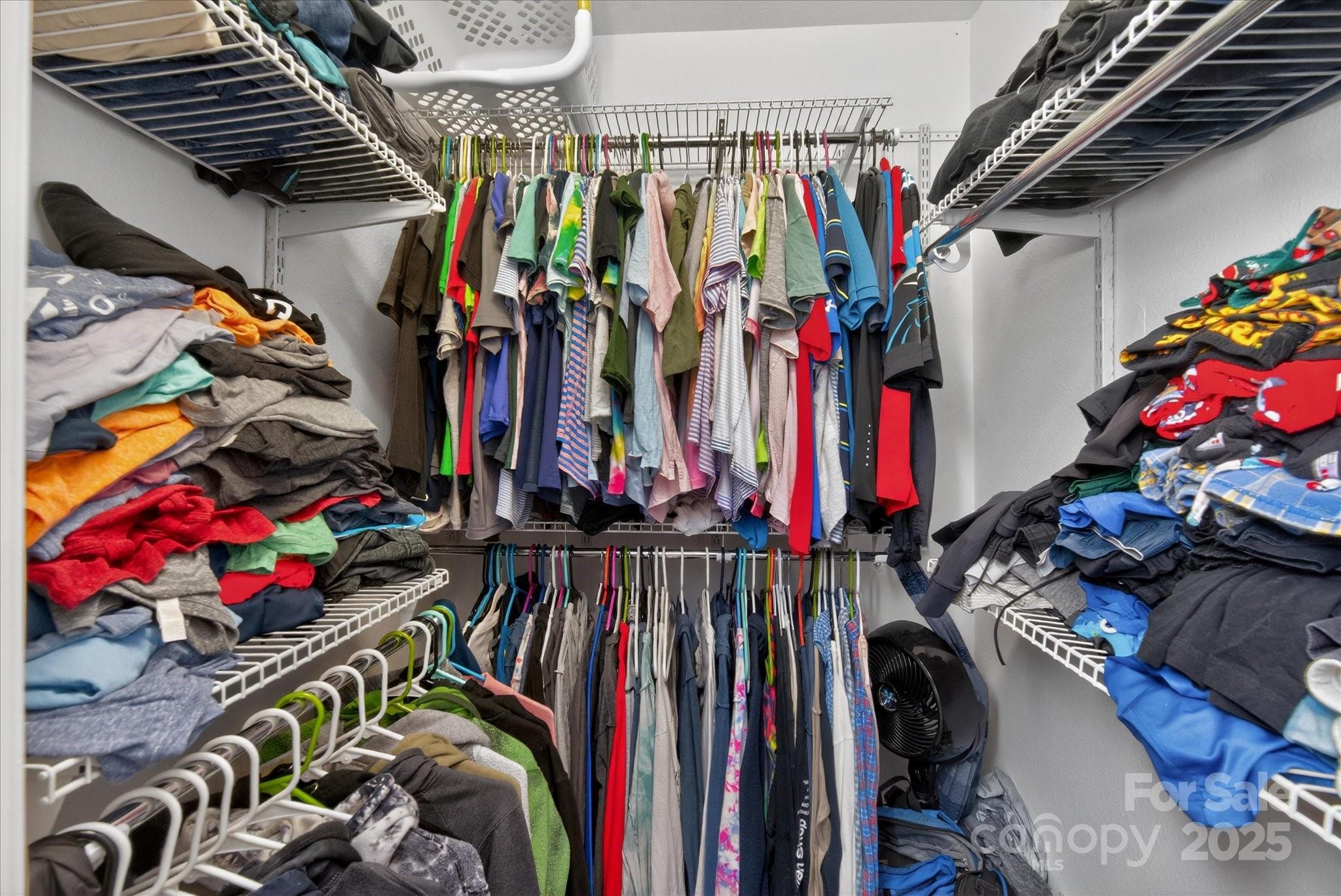 6331 Rhodins Lane Fort Mill, SC 29707 - Photo 25 of 45 a view of walk in closet with clothes