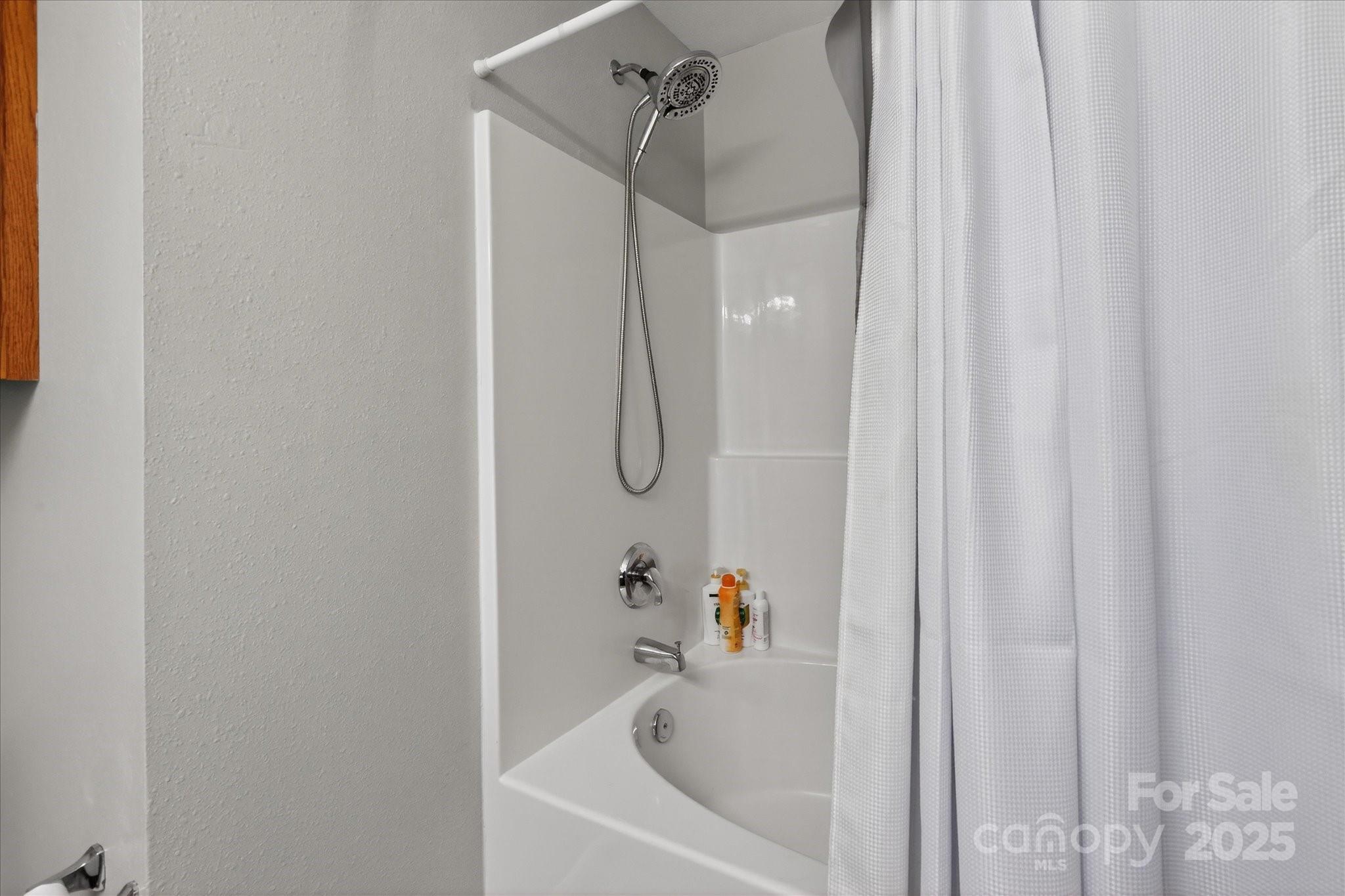 6331 Rhodins Lane Fort Mill, SC 29707 - Photo 27 of 45 a bathroom with a bathtub and shower