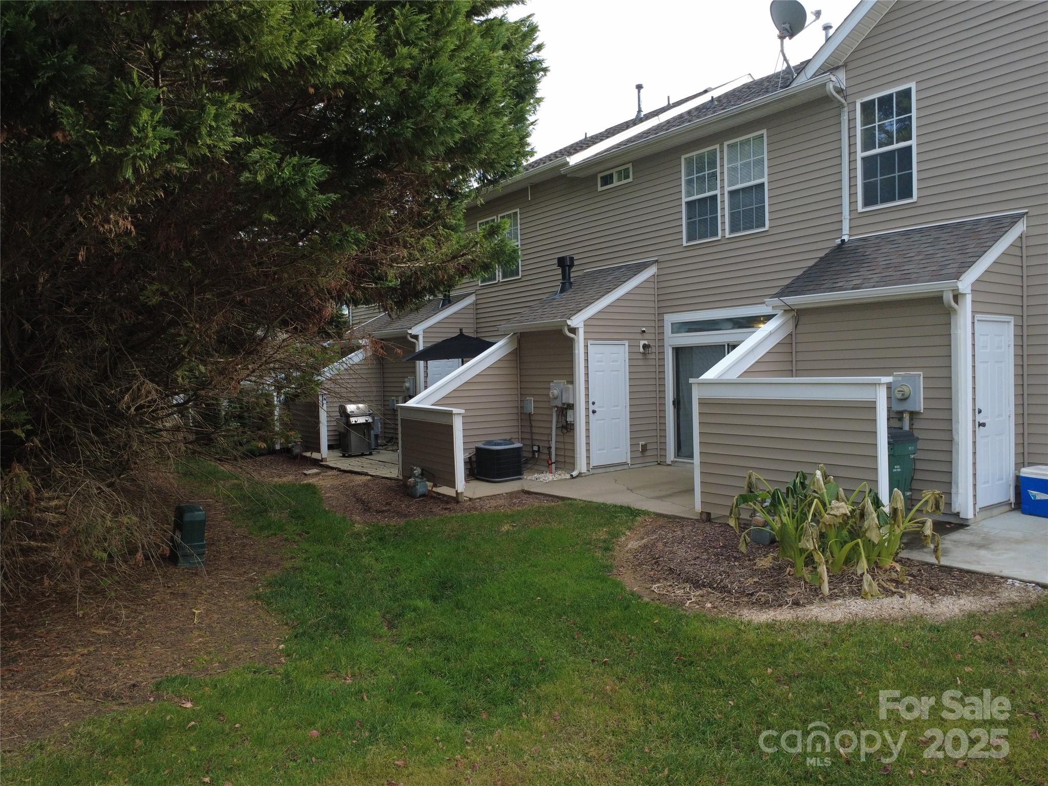 6331 Rhodins Lane Fort Mill, SC 29707 - Photo 36 of 45 a front view of a house with a yard and trees