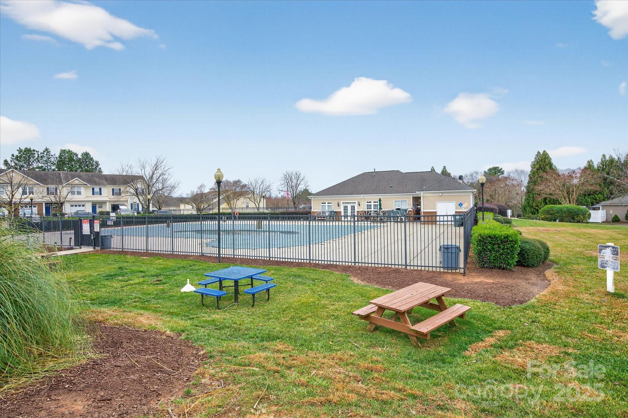 6331 Rhodins Lane Fort Mill, SC 29707 - Photo 42 of 45 a view of a backyard with a garden and swimming pool