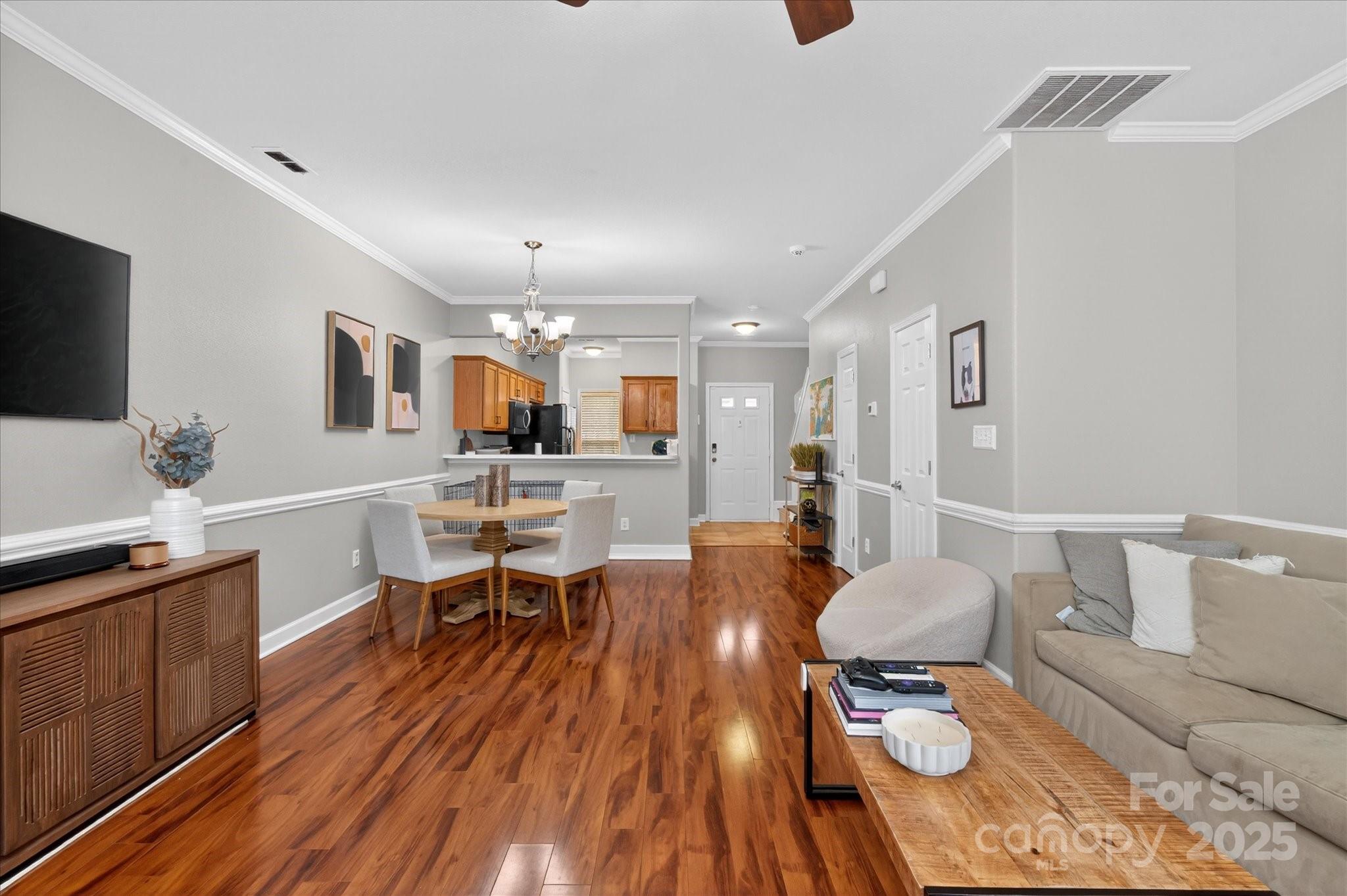 6331 Rhodins Lane Fort Mill, SC 29707 - Photo 9 of 45 a view of a dining room with furniture and wooden floor