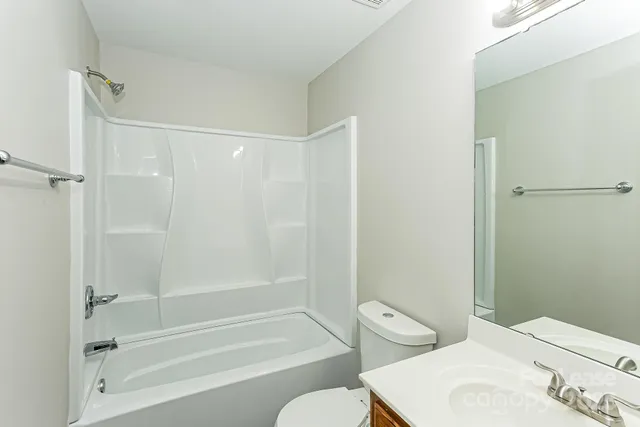 a bathroom with a bathtub toilet and sink