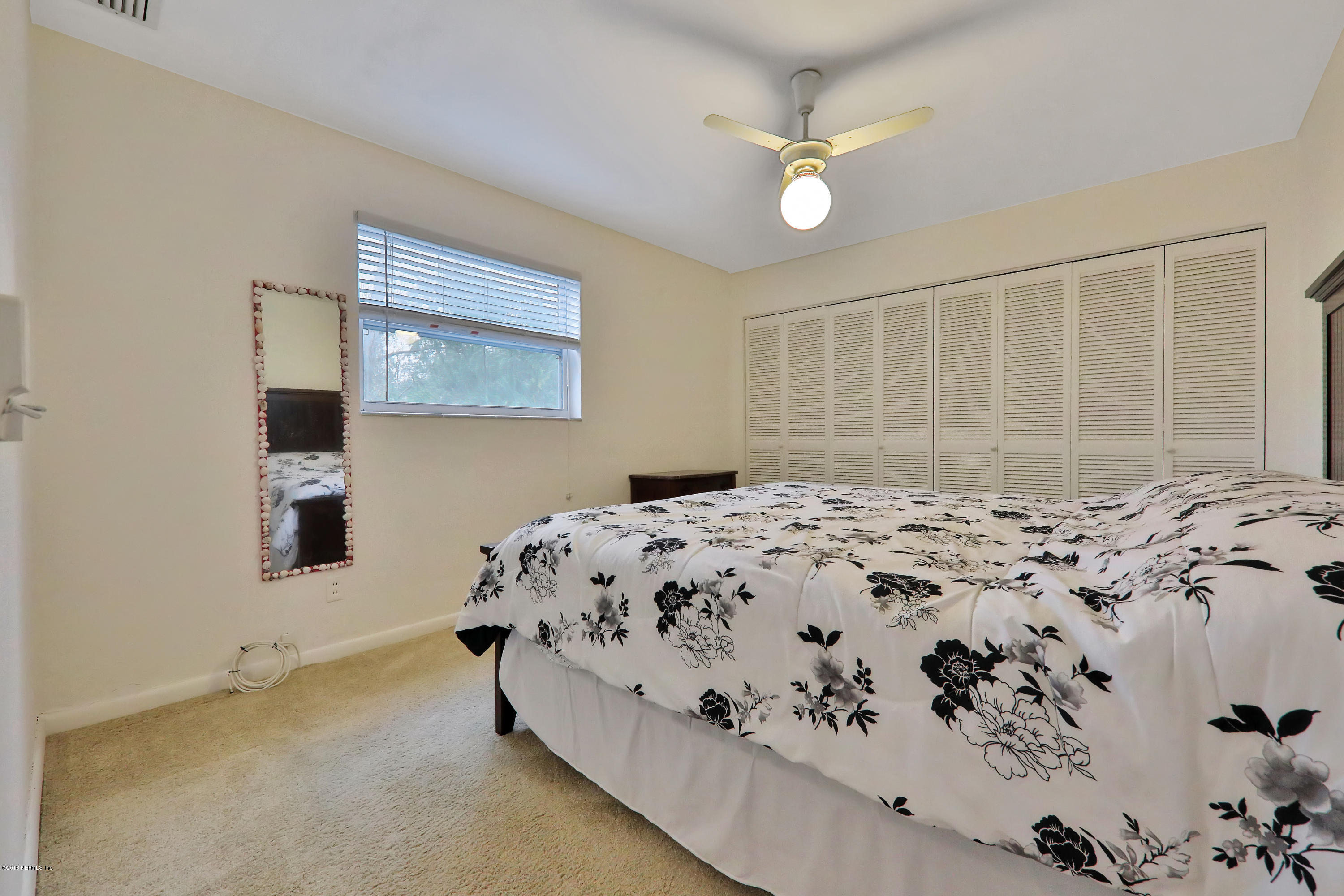 2519 Sam Road Jacksonville, FL 32216 - Photo 18 of 26 a bedroom with a bed and a window