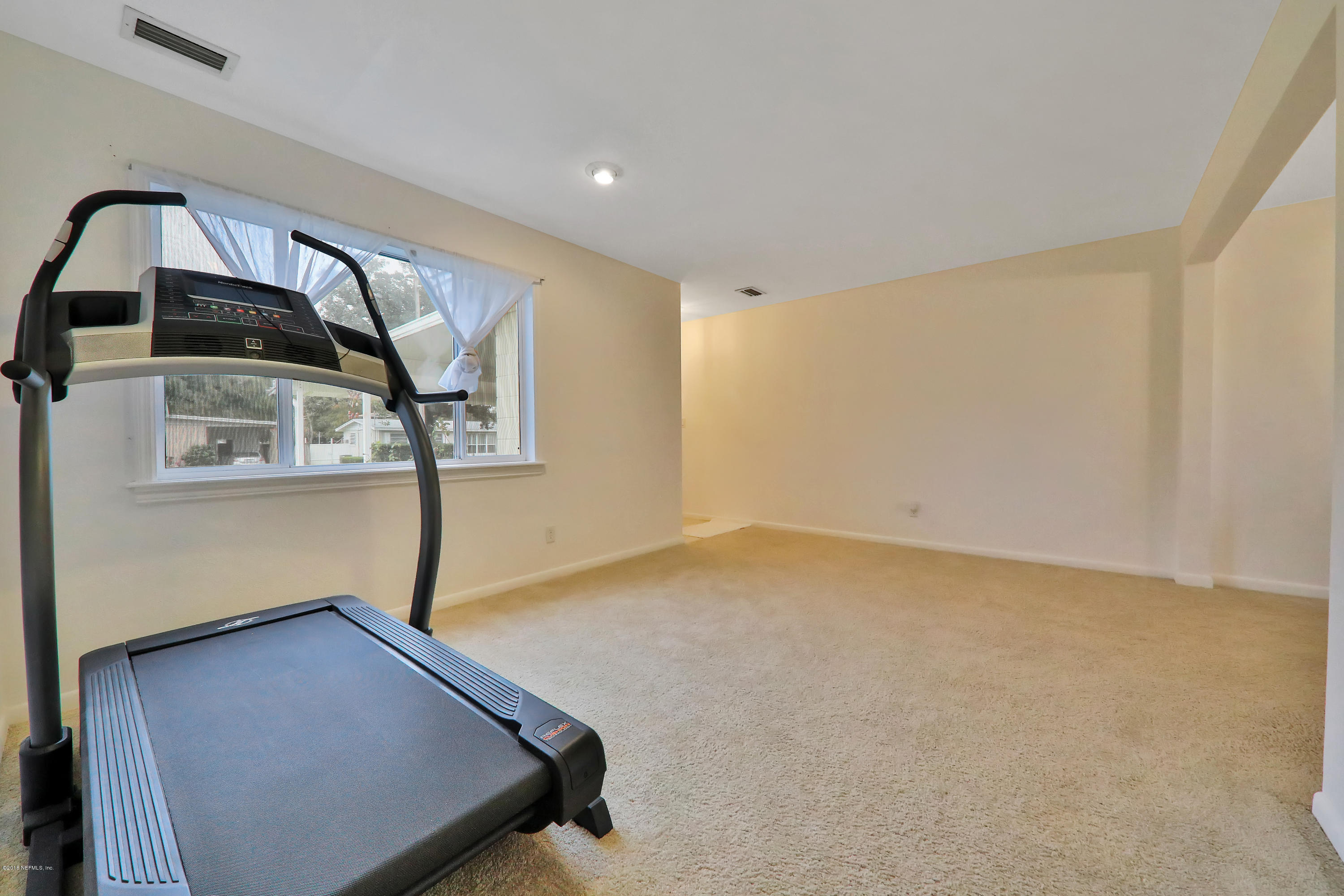 2519 Sam Road Jacksonville, FL 32216 - Photo 4 of 26 a view of a room with wooden floor and windows