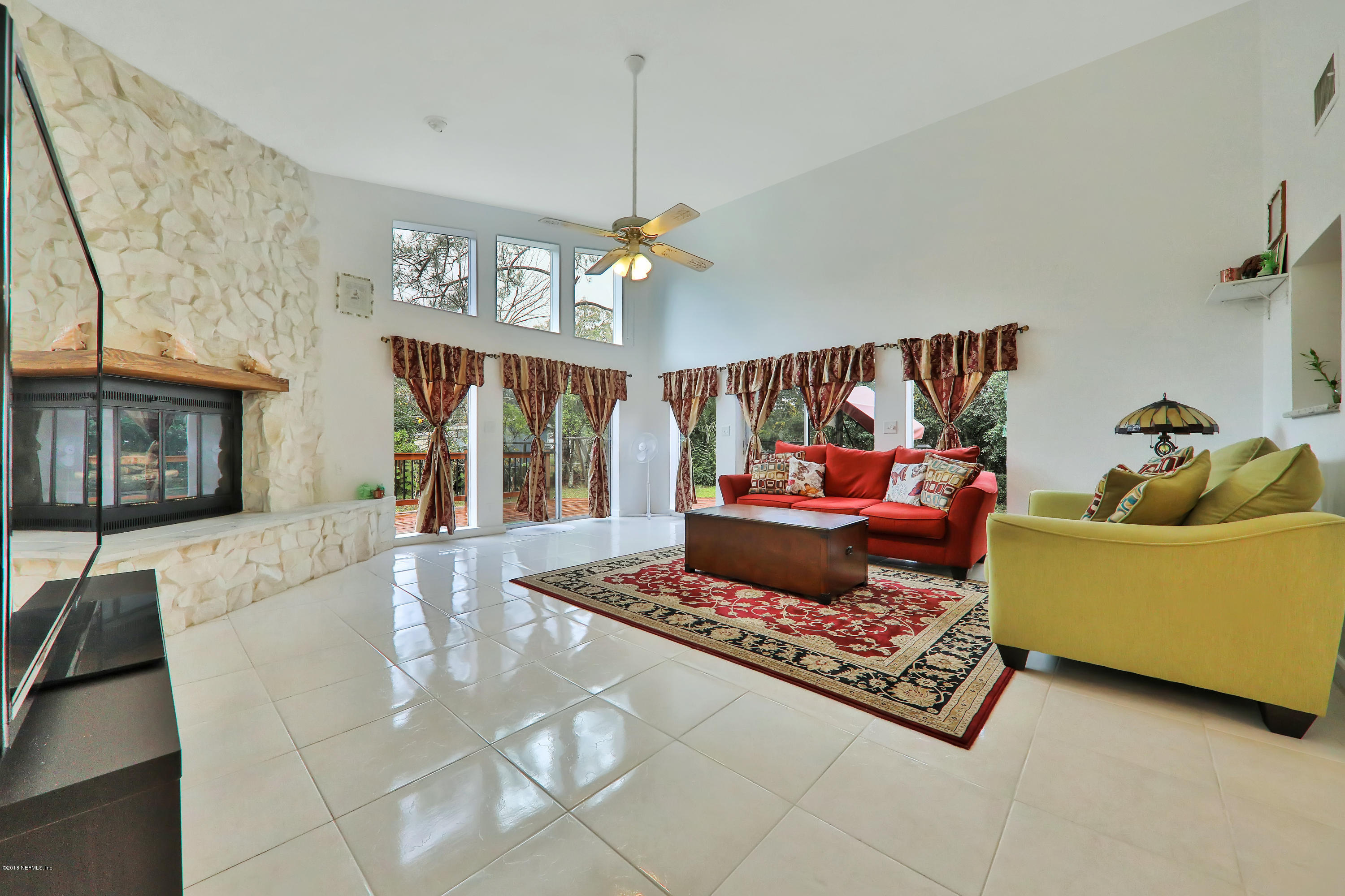 2519 Sam Road Jacksonville, FL 32216 - Photo 7 of 26 a living room with furniture and a chandelier