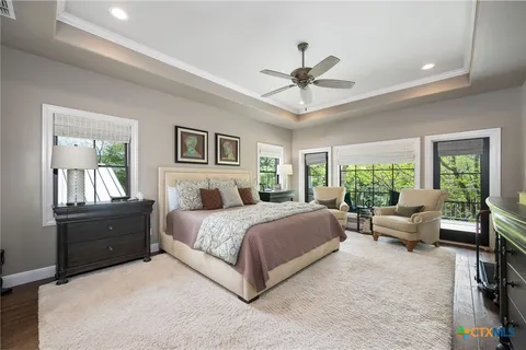 a spacious bedroom with a large bed and a window