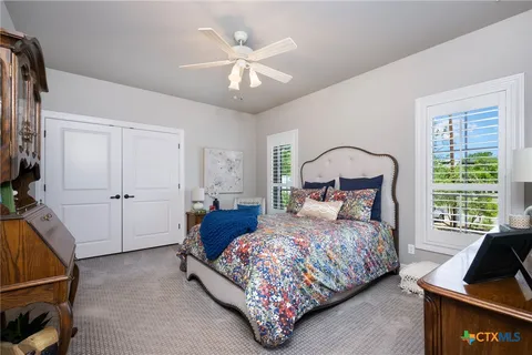 a bedroom with a bed and a couch