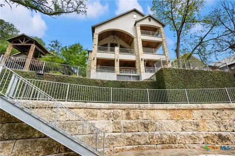 a front view of a house with a fence