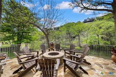 a view of a patio with a table chairs and a table