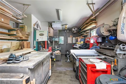 a kitchen filled with stainless steel appliances granite countertop a stove and a sink
