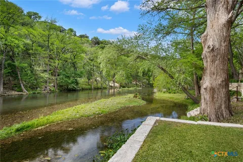 a view of a lake with a yard