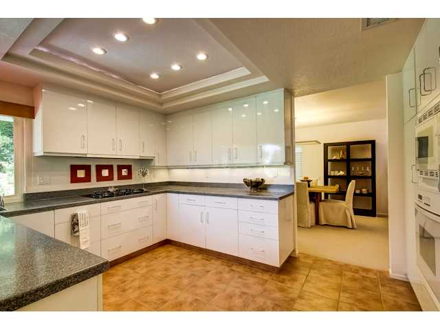 1416 Sun Valley Road Solana Beach, CA 92075 - Photo 9 of 25 Great lighting, tile floor, and ample storage. Cabinets and storage cupboards have pull-out drawers