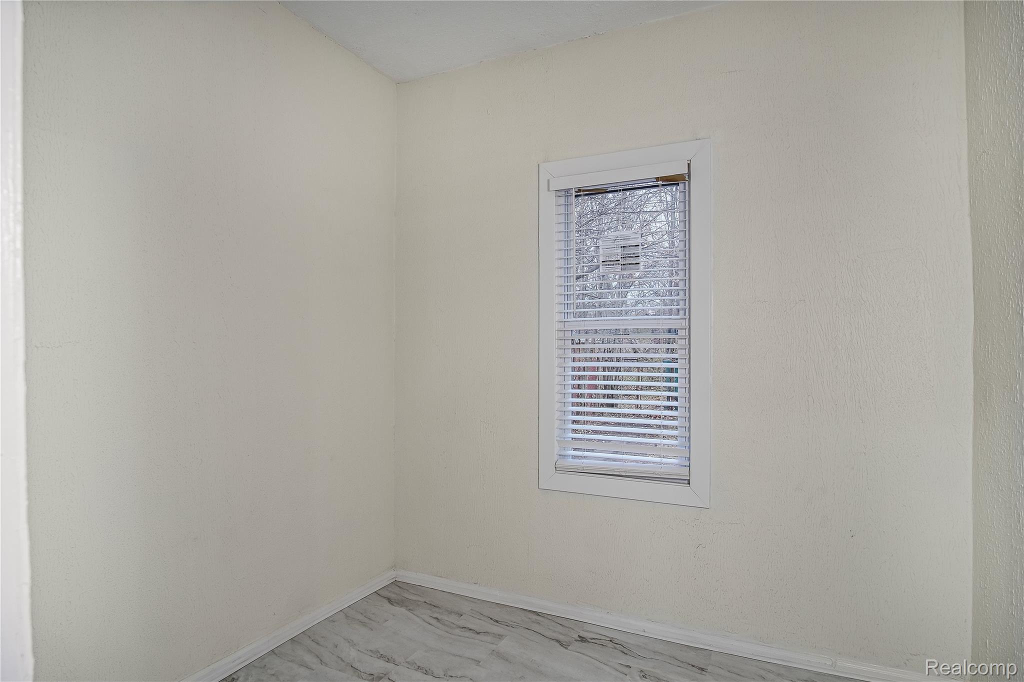 427 Melbourne Street Detroit, MI 48202 - Photo 19 of 29 Unfurnished room featuring baseboards and marble finish floors