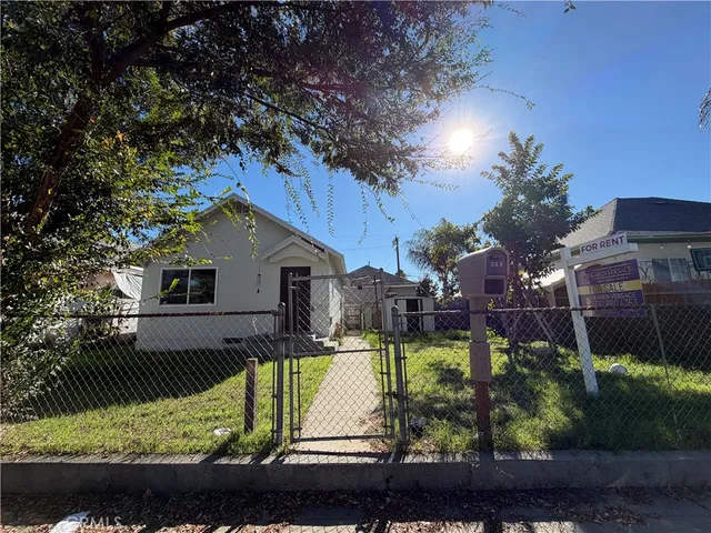 a kitchen with granite countertop a sink stainless steel appliances and cabinets