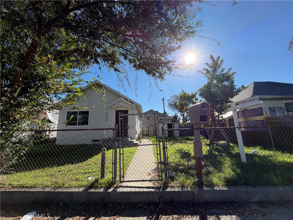 890 4th Street Pomona, CA 91766 - Photo 1 of 11 a view of a house with a yard