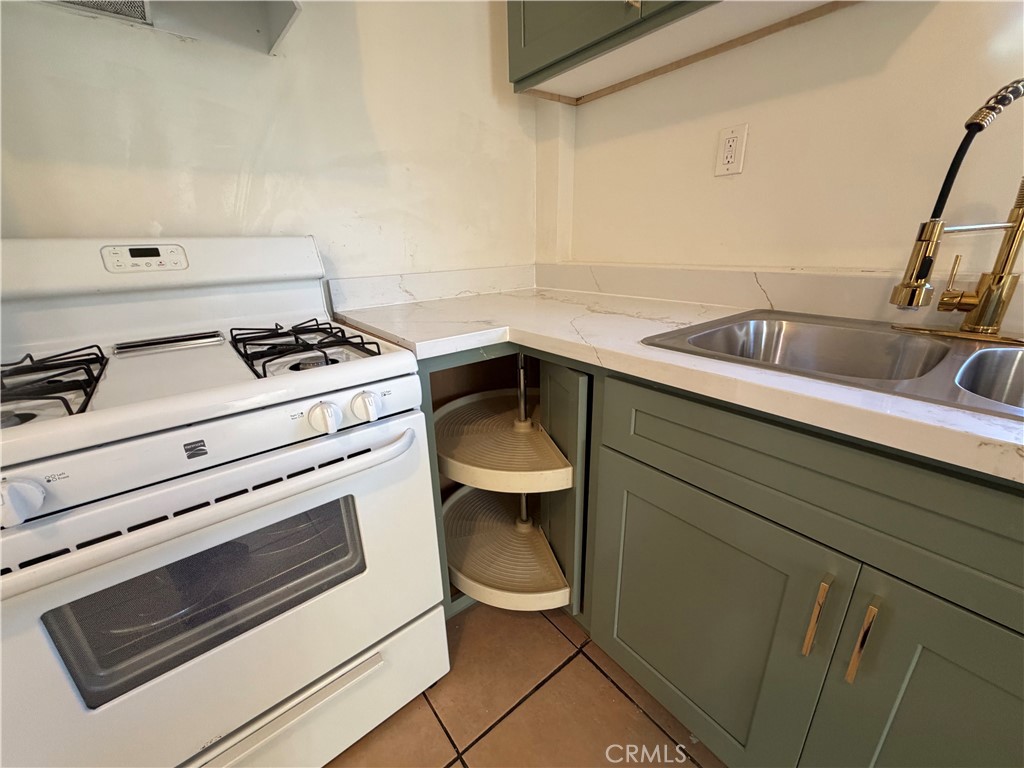 890 4th Street Pomona, CA 91766 - Photo 11 of 11 a kitchen with a stove and a sink