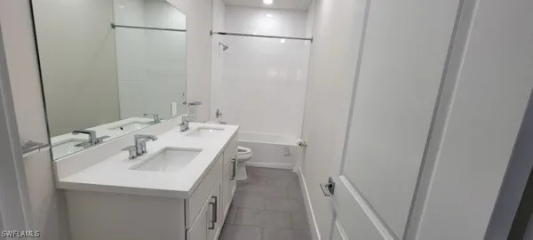 a bathroom with a sink a mirror and a shower
