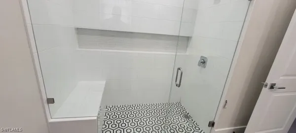 a bathroom with a sink and a shower