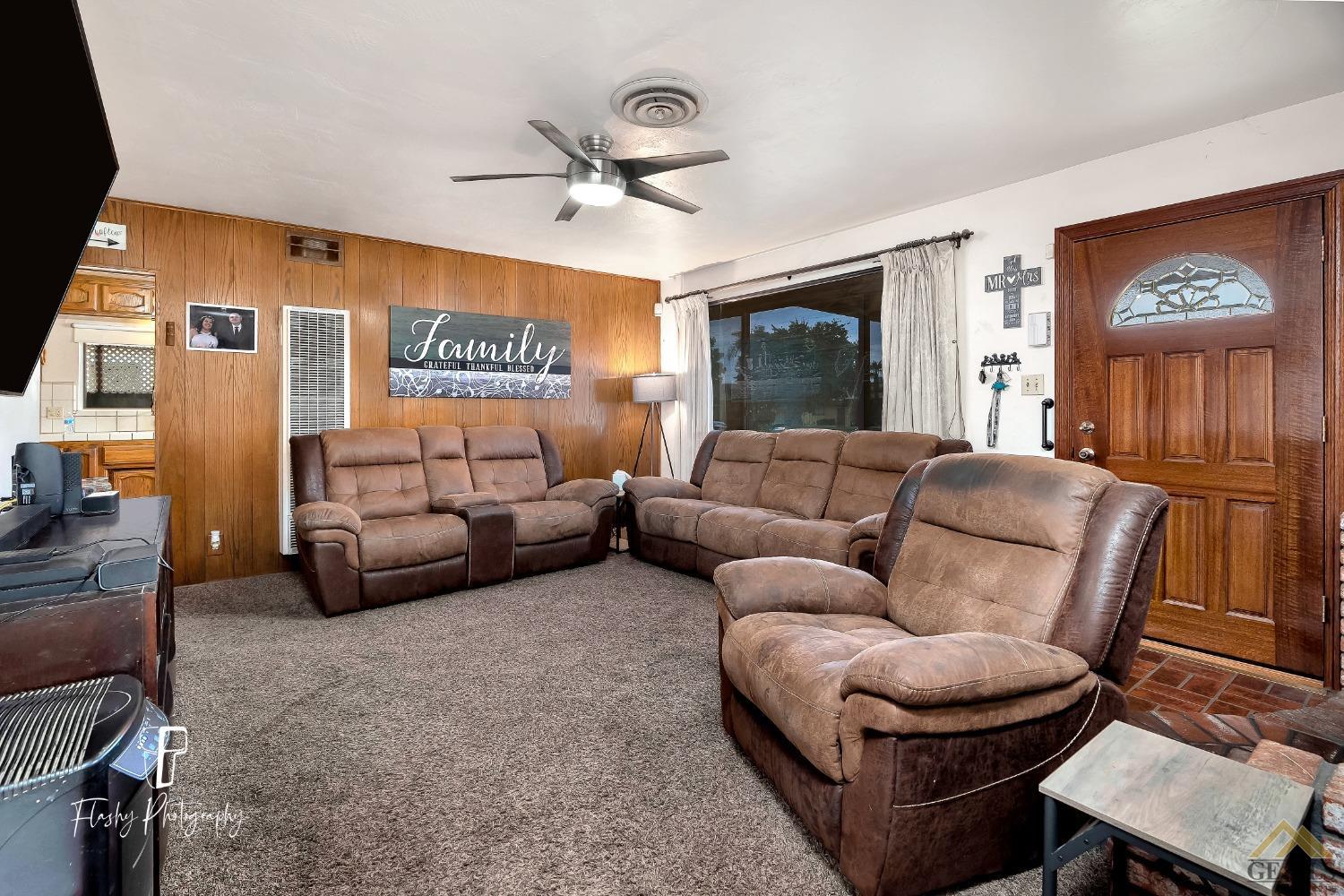 Undisclosed Address Bakersfield, CA 93304 - Photo 11 of 38 a living room with furniture and a large window