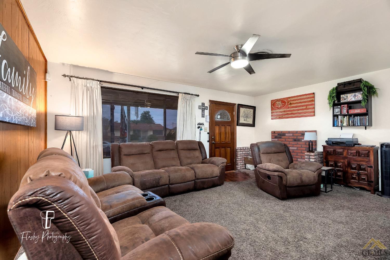 Undisclosed Address Bakersfield, CA 93304 - Photo 12 of 38 a living room with furniture and a large window