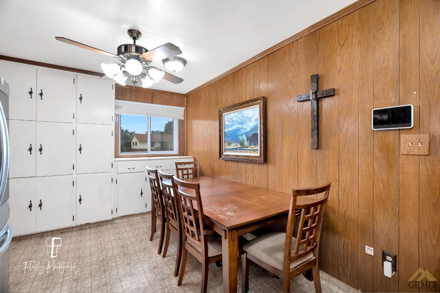 Undisclosed Address Bakersfield, CA 93304 - Photo 17 of 38 a view of a dining room with furniture and chandelier