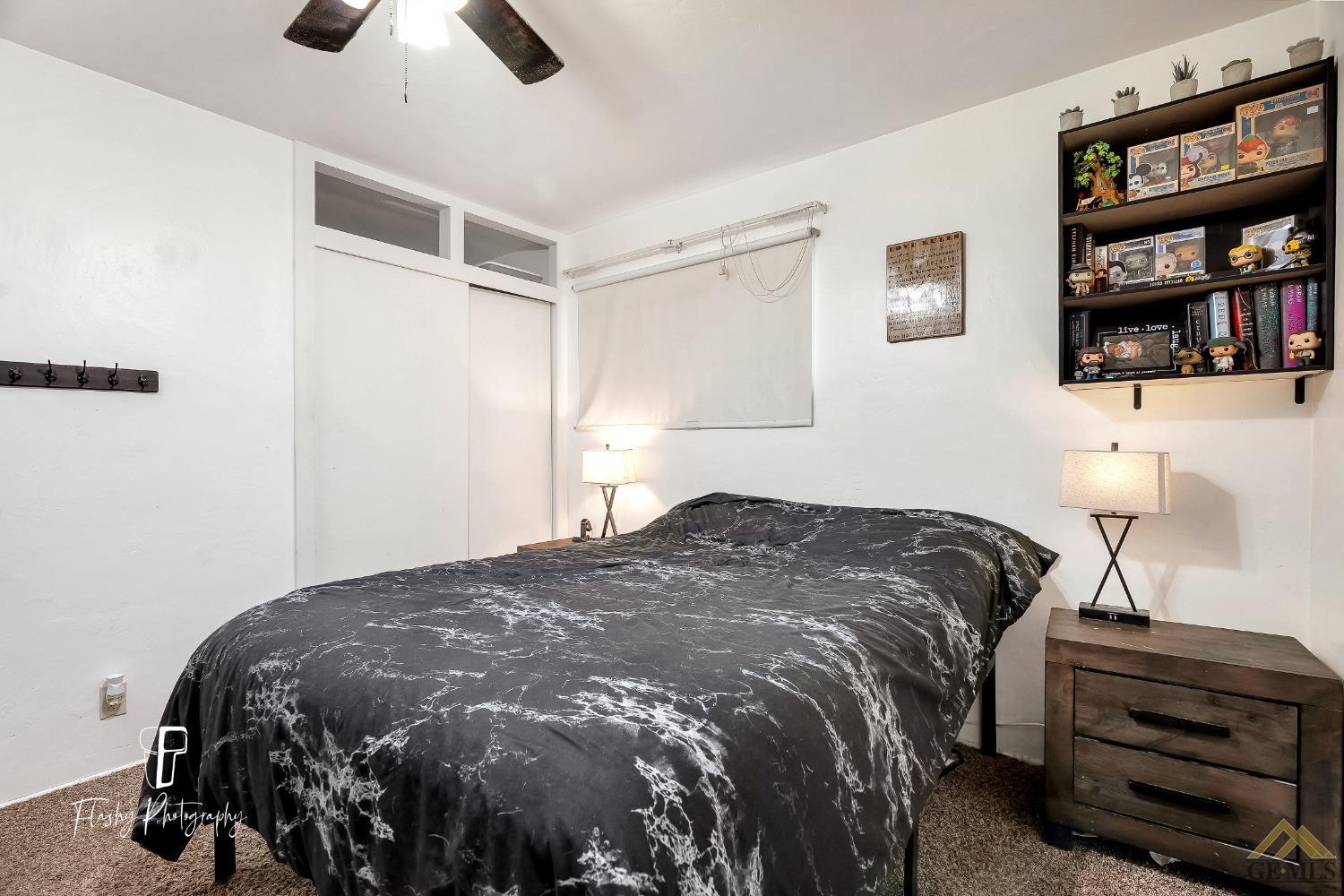 Undisclosed Address Bakersfield, CA 93304 - Photo 20 of 38 a bedroom with a bed and a window