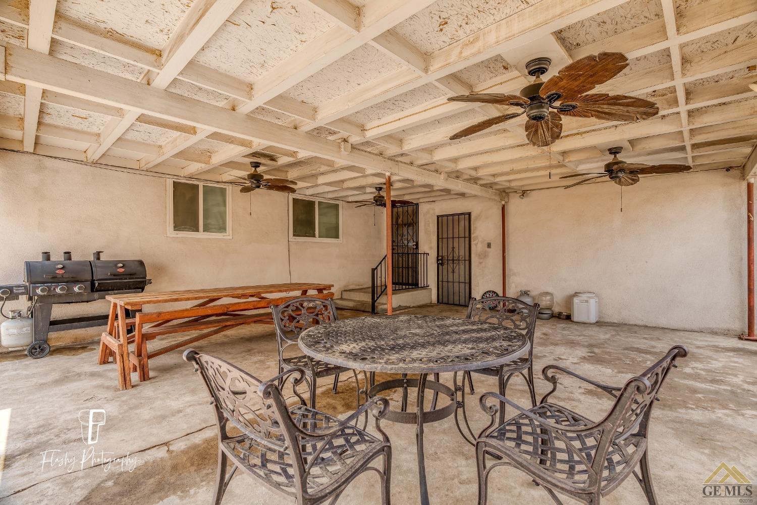 Undisclosed Address Bakersfield, CA 93304 - Photo 29 of 38 a view of a patio with a table and chairs
