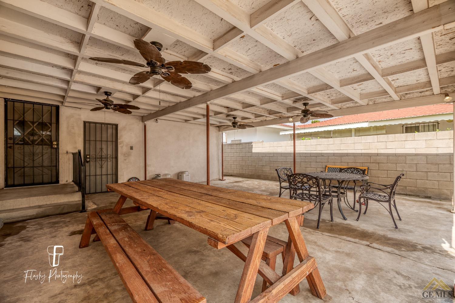 Undisclosed Address Bakersfield, CA 93304 - Photo 30 of 38 a outdoor space with pool table and chairs