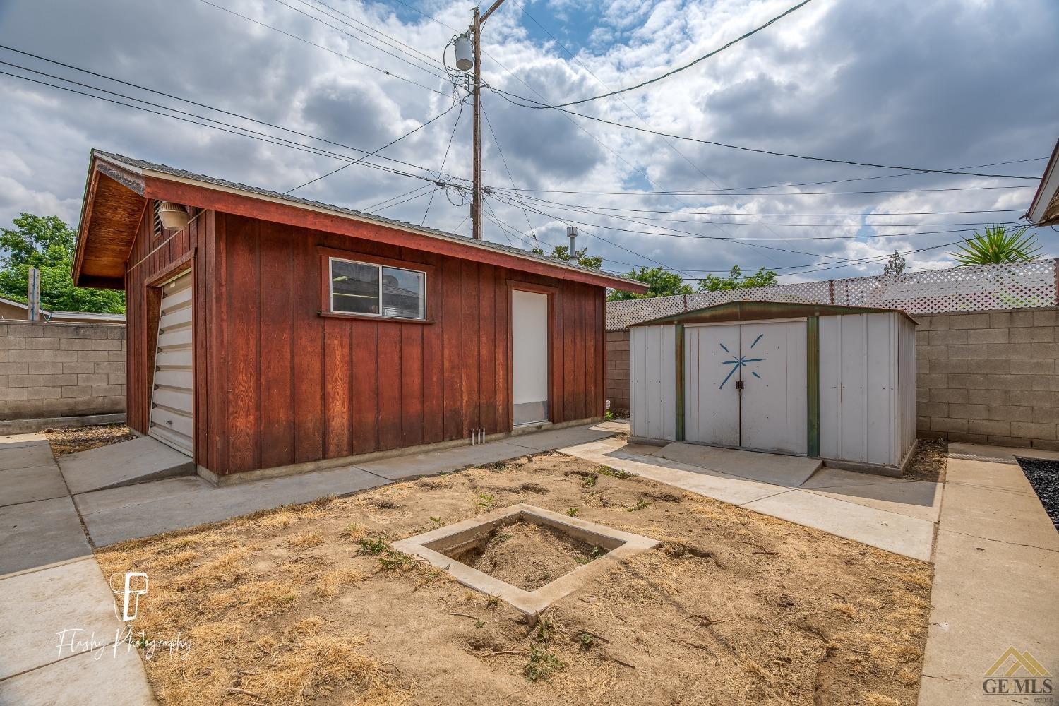 Undisclosed Address Bakersfield, CA 93304 - Photo 36 of 38 a view of backyard with garage