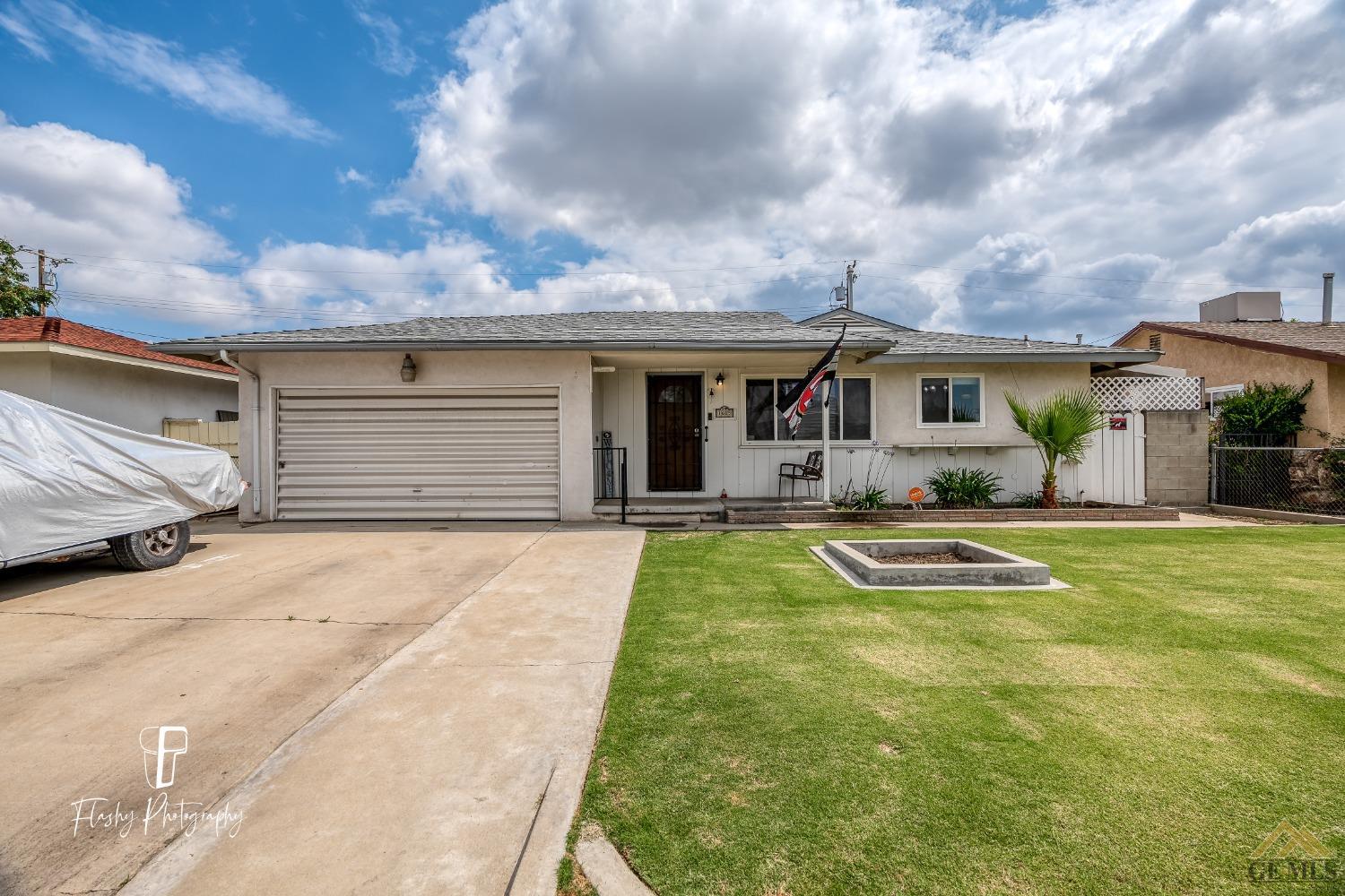 Undisclosed Address Bakersfield, CA 93304 - Photo 4 of 38 a front view of house with yard