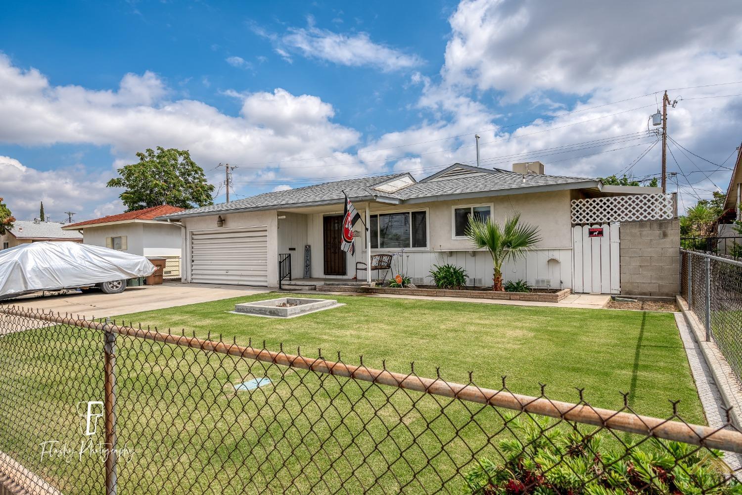 Undisclosed Address Bakersfield, CA 93304 - Photo 7 of 38 a view of a house with backyard and sitting area