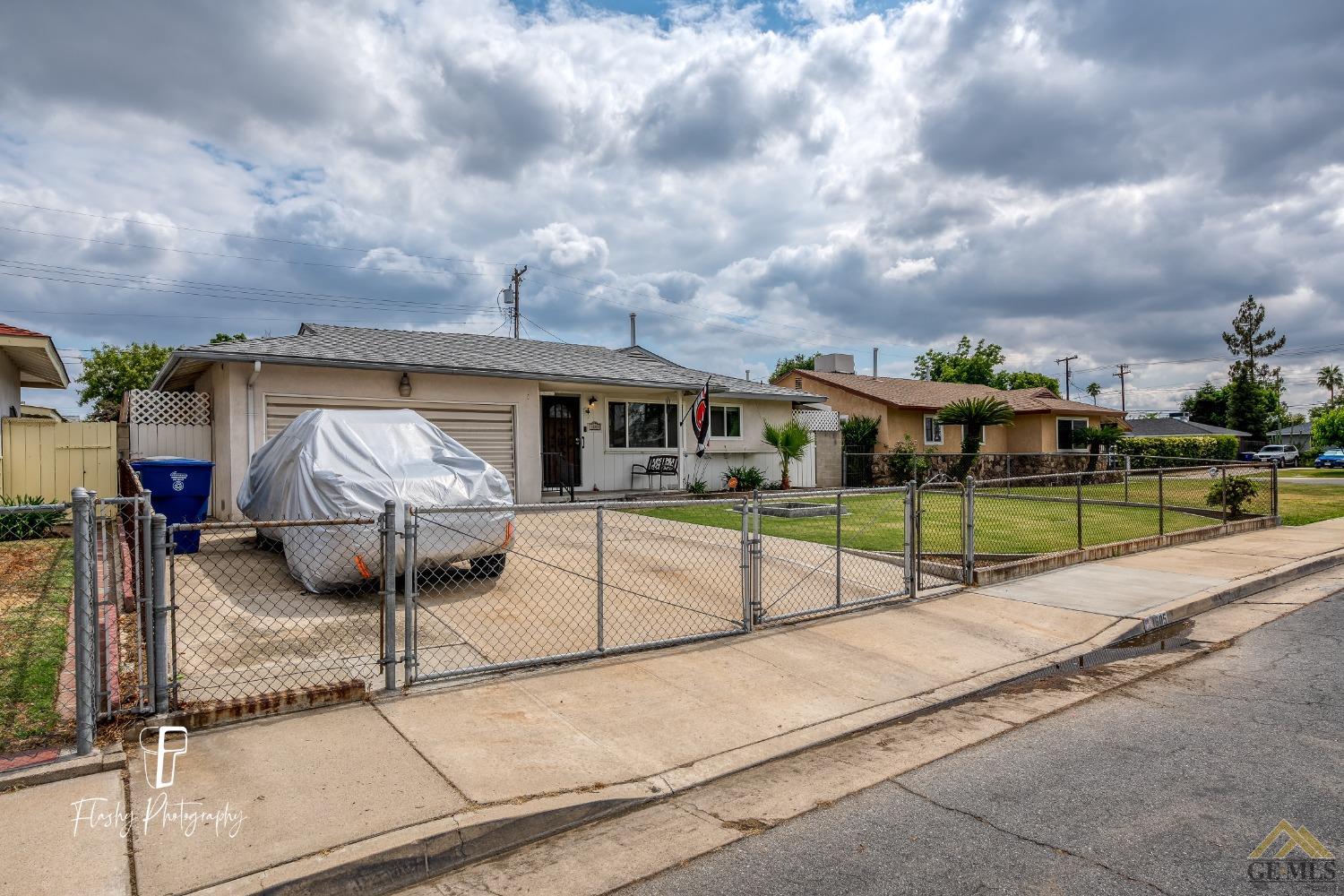 Undisclosed Address Bakersfield, CA 93304 - Photo 8 of 38 a view of a house with backyard and sitting area