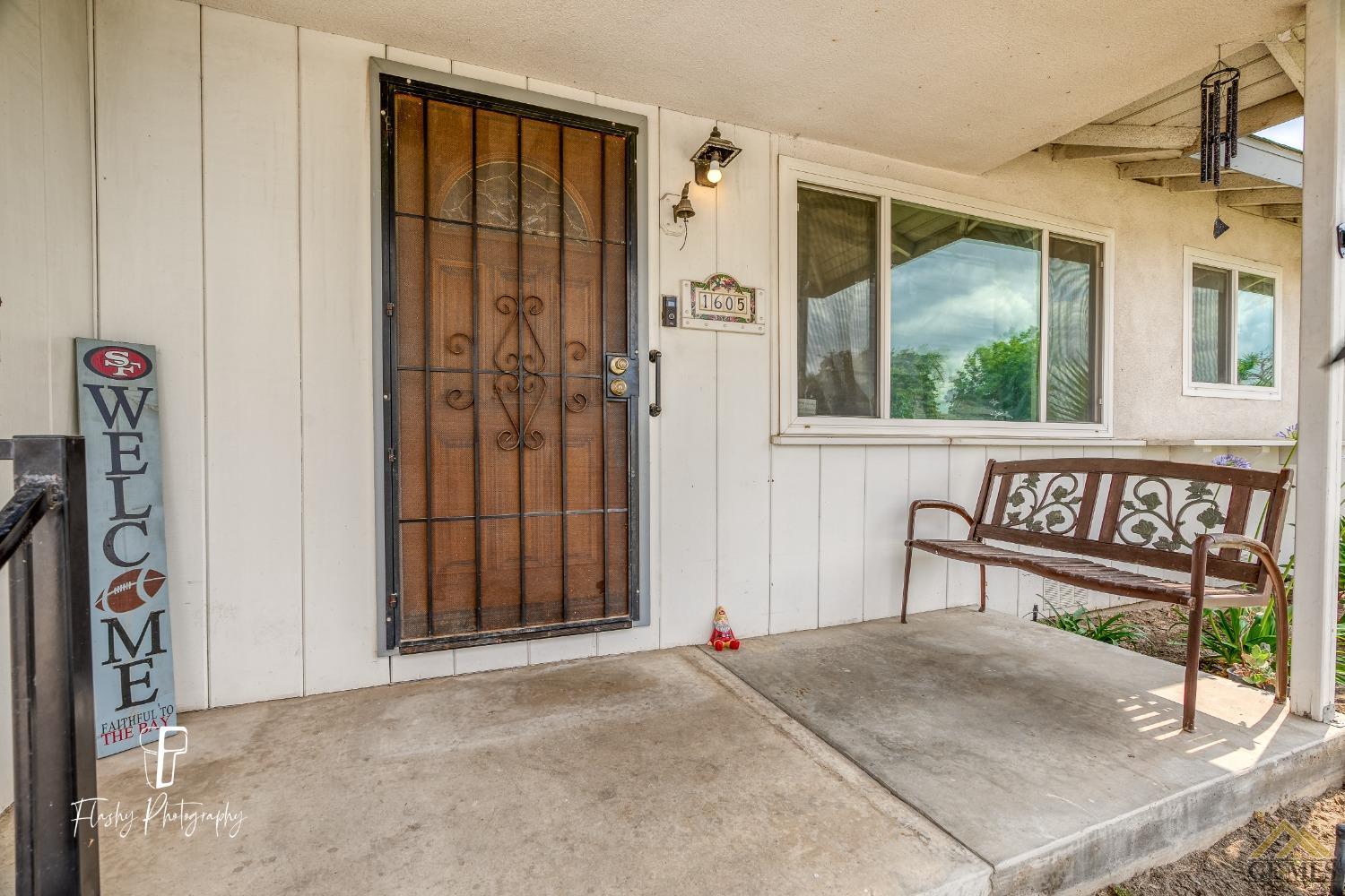 Undisclosed Address Bakersfield, CA 93304 - Photo 9 of 38 a view of a house with a garage