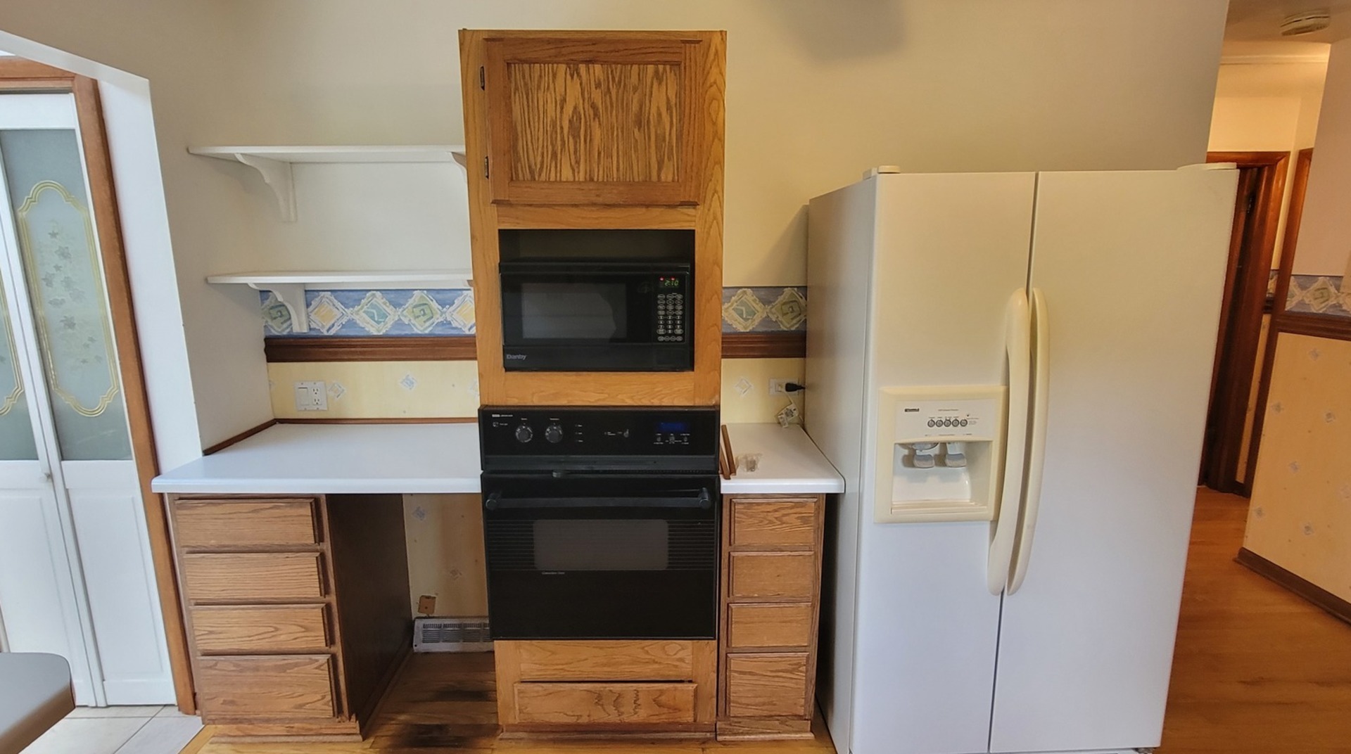 24049 West Grass Lake Road Antioch, IL 60002 - Photo 4 of 26 a kitchen with stainless steel appliances a refrigerator and a stove