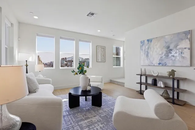 a bathroom with a sink mirror and toilet