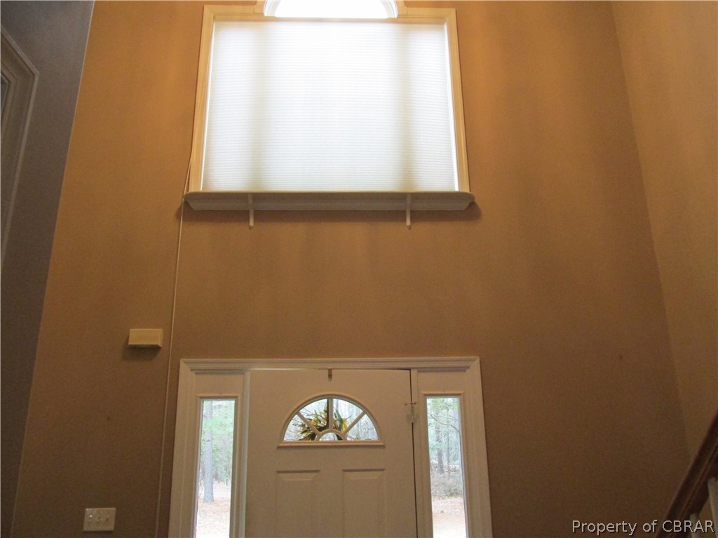 669 Croxtons Road Jamaica, VA 23079 - Photo 22 of 33 A glance at the huge window above the door lets natural light into the entry. There is another window like this in the LR/FR over the french doors leading to the deck. The light and airy feel to this home is hard to miss!