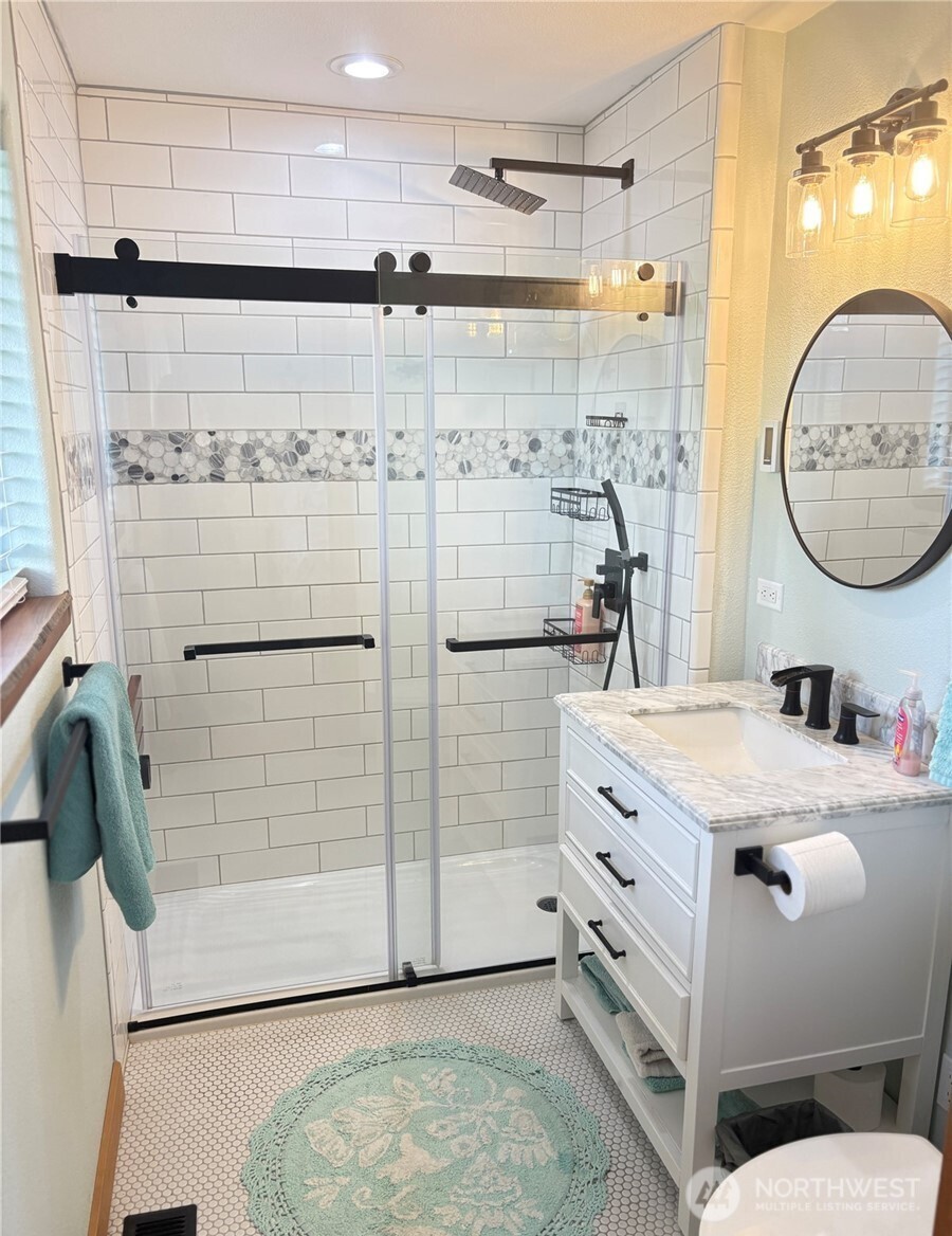 8 Mundinger Lane Omak, WA 98841 - Photo 16 of 37 a bathroom with a granite countertop sink mirror and shower