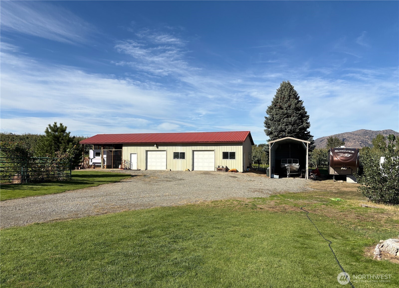 8 Mundinger Lane Omak, WA 98841 - Photo 25 of 37 a front view of a house with a yard
