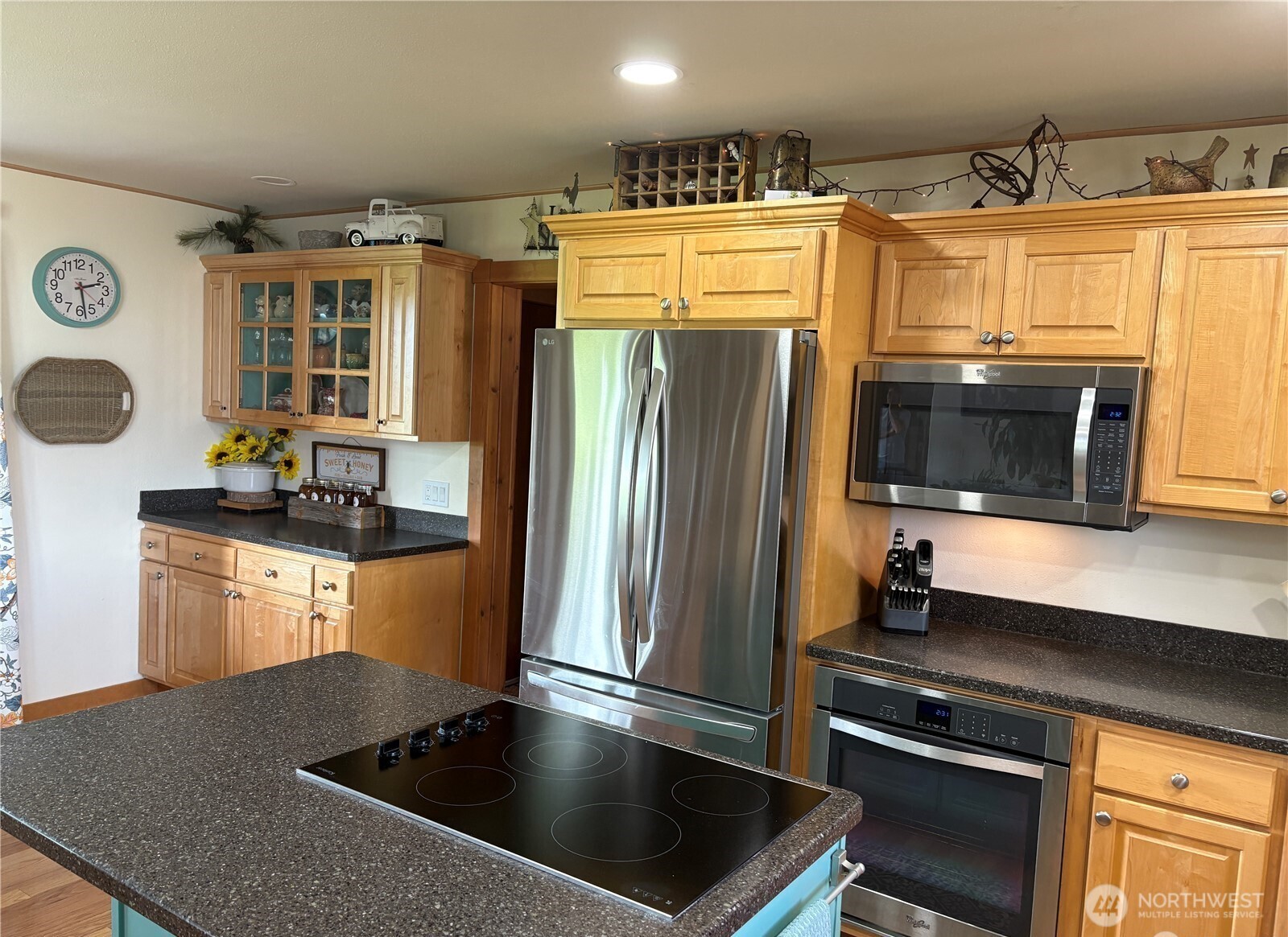 8 Mundinger Lane Omak, WA 98841 - Photo 8 of 37 a kitchen with granite countertop a refrigerator and a stove top oven
