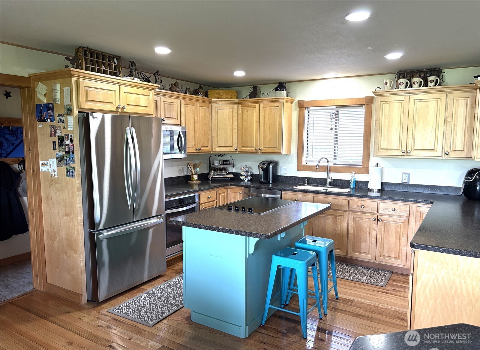 8 Mundinger Lane Omak, WA 98841 - Photo 10 of 37 a kitchen with stainless steel appliances granite countertop a refrigerator a sink and a stove