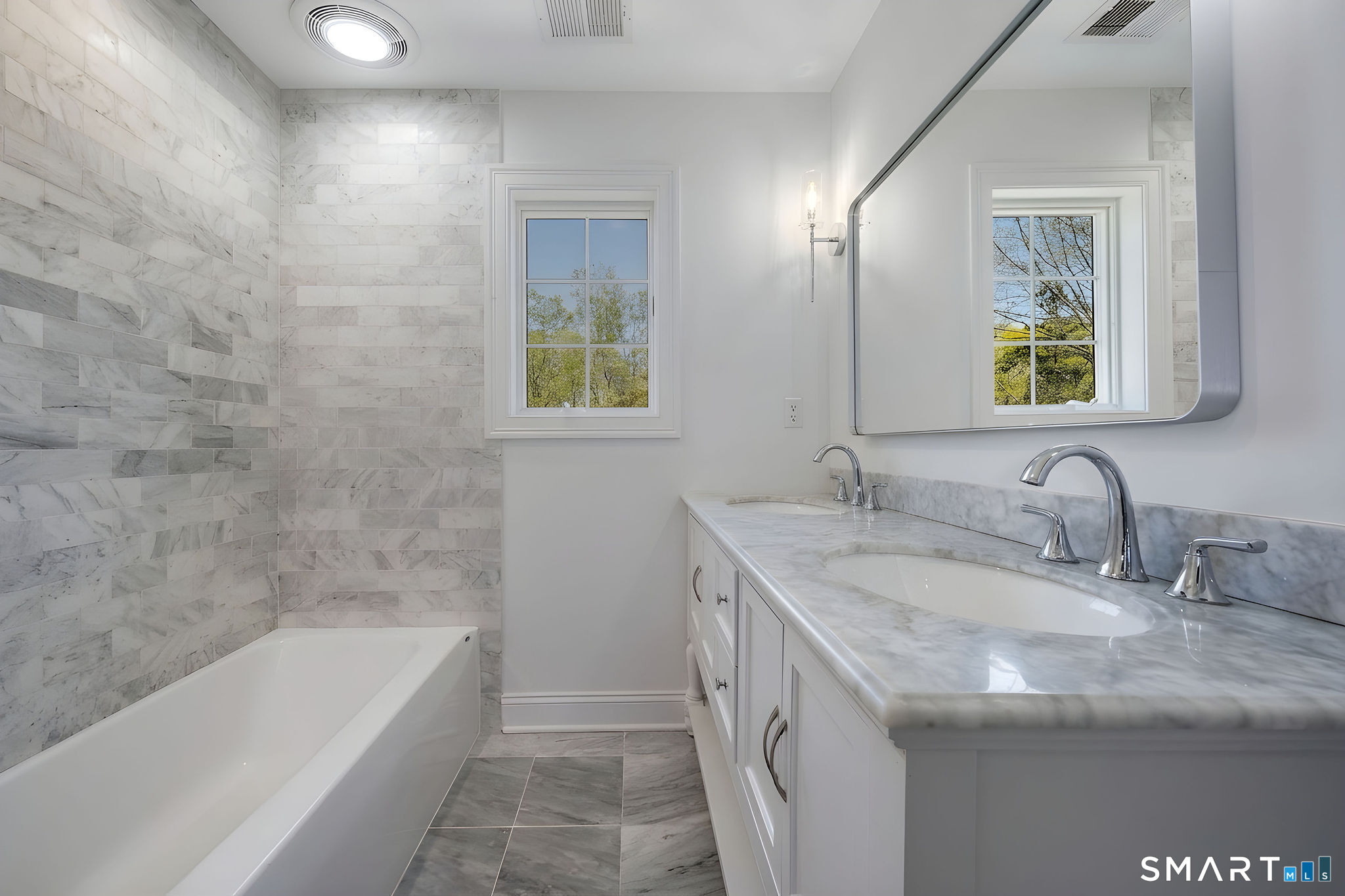 9 Sunset Ridge Drive Guilford, CT 06437 - Photo 25 of 40 a bathroom with a tub sink and mirror