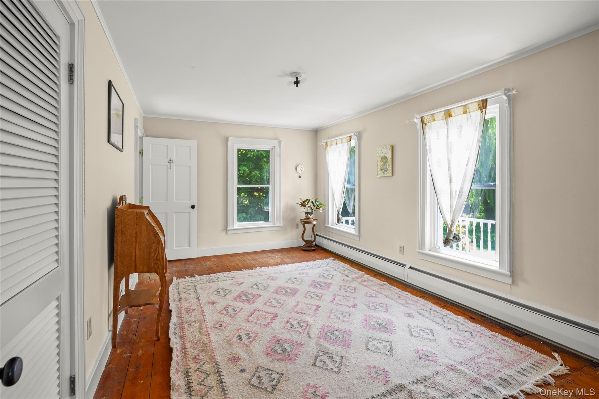 202 Buckwheat Road Hudson, NY 12534 - Photo 24 of 49 a view of a bedroom with wooden floor and a window