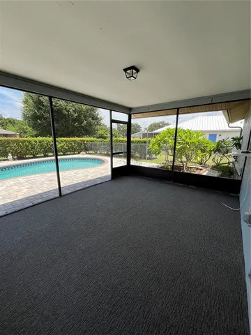 a view of an empty room with a large window