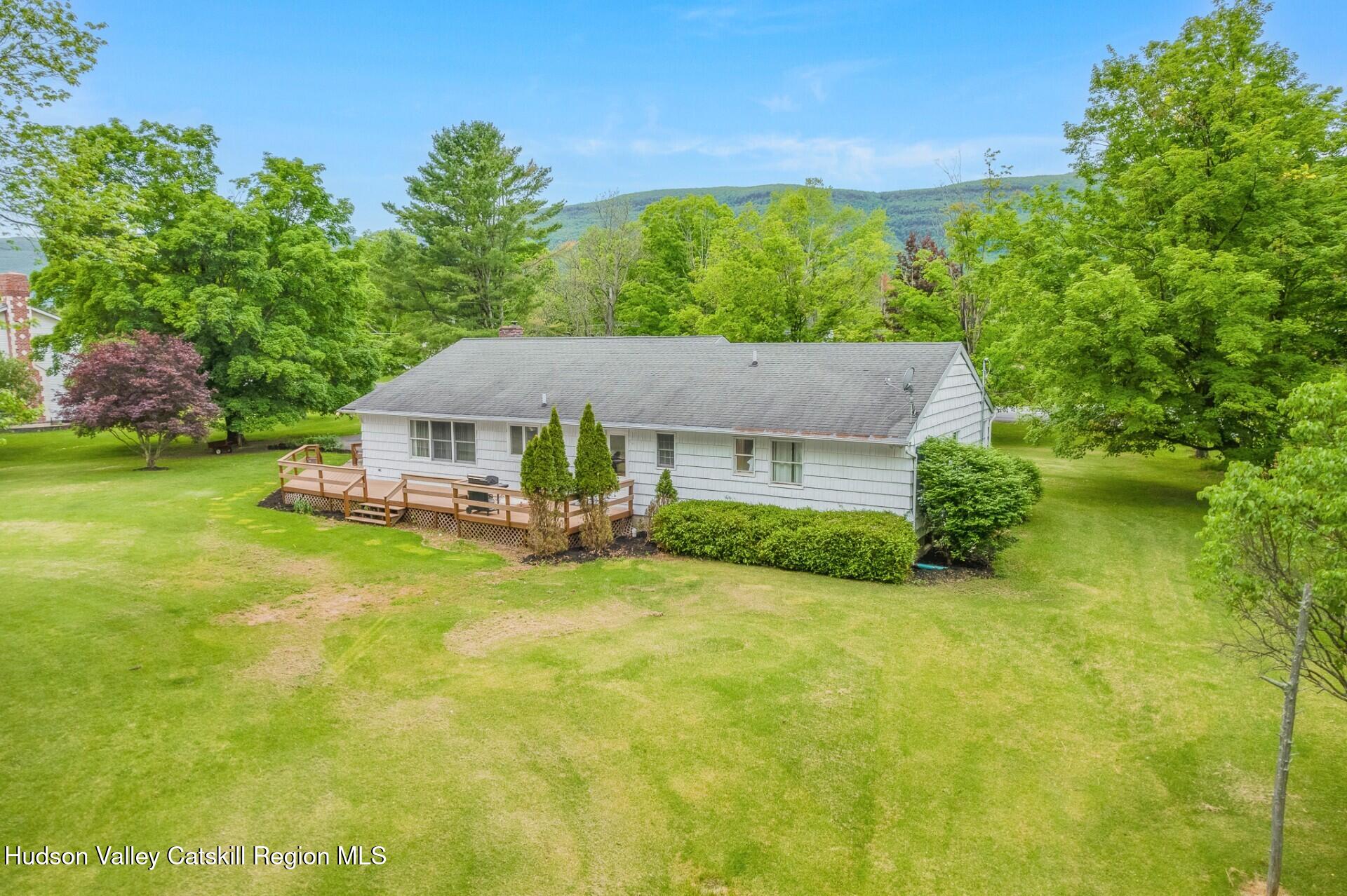 984 Blue Mountain Road Saugerties, NY 12477 - Photo 2 of 24 a aerial view of a house with swimming pool next to a big yard